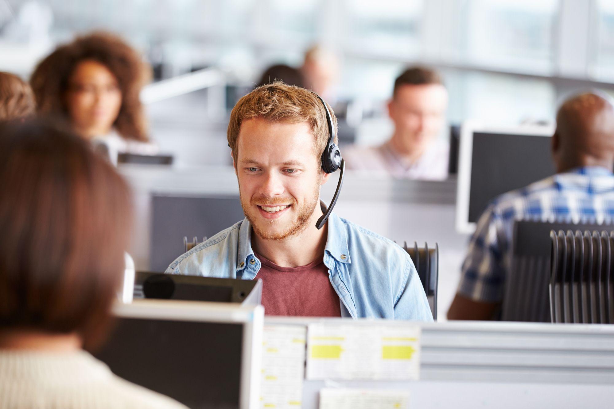 A person using their headset in a call centre